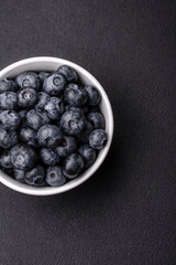 Delicious fresh sweet blueberries in a ceramic bowl. Vegan food
