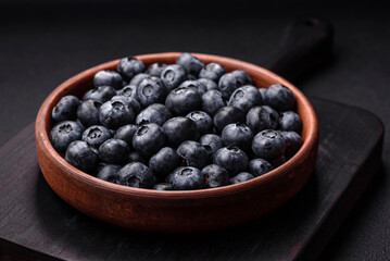 Delicious fresh sweet blueberries in a ceramic bowl. Vegan food