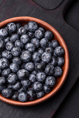 Delicious fresh sweet blueberries in a ceramic bowl. Vegan food
