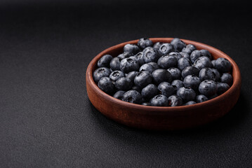 Delicious fresh sweet blueberries in a ceramic bowl. Vegan food