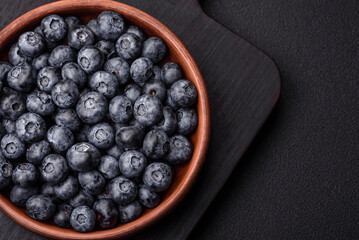 Delicious fresh sweet blueberries in a ceramic bowl. Vegan food