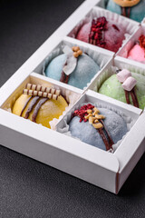 Delicious sweet colorful mochi desserts or ice cream with rice dough and toppings