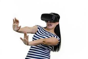 Frightened woman wearing vr headset stratching her arms saying stay away from me. Scared brunette woman in terror isolated on white.