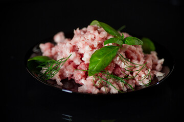 chopped fresh minced pork meat in a plate