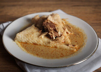 Lontong is an Indonesian dish made of compressed rice cake in the form of a cylinder wrapped inside a banana leaf, commonly found in Indonesia, Malaysia and Singapore. 