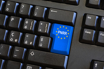 words 'PNRR' on blue key of a laptop keyboard. The National Recovery and Resilience Plan is part of the Next Generation EU Programme.