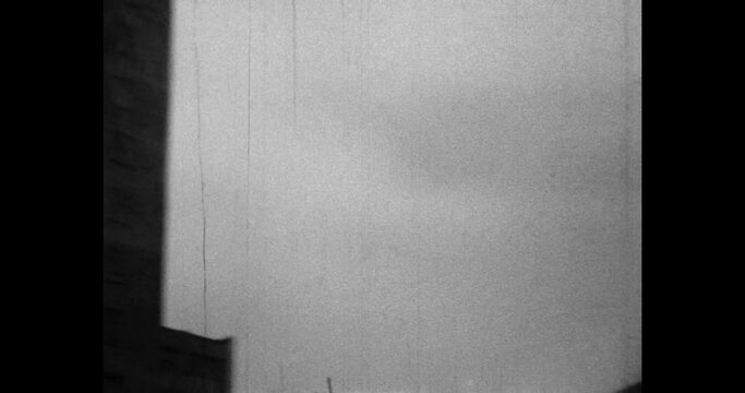 Panel high-rise buildings in city. Typical stagnant residential building architecture. Urban apartment house. Housing in town. Archival vintage black white film. Old retro archive 1980s Moscow, Russia