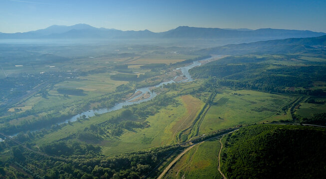 Rupite area Bulgaria, aerial photography. View of the valley in early spring with a stunning panorama of the mountains and the river in the mist at dawn