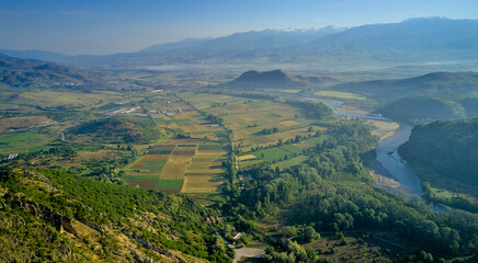 Rupite area Bulgaria, aerial photography. View of the valley in early spring with a stunning panorama of the mountains and the river in the mist at dawn
