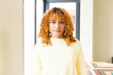 young red hair latin pretty womann at new cool home