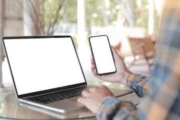 computer screen,cell phone blank mockup.hand woman work using laptop texting mobile.white background for advertising,contact business search information on desk in cafe.marketing,design