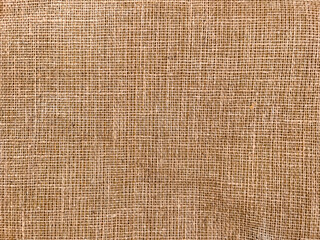 Woven synthetic jute carpet backing pattern as background
