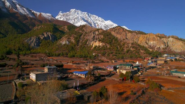Aerial panning view Humde village house panorama. Annapurna circuit trek. Marshyangdi valley. Himalayas mountain range. Nepalese house buildings architecture. 