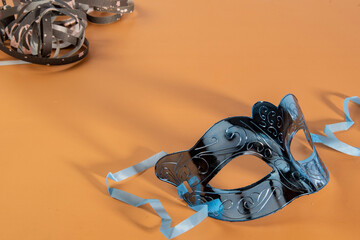 Venetian carnival mask, forming frame in one of the lower corners with space for text