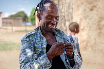 portrait of an rasta african man in the village,