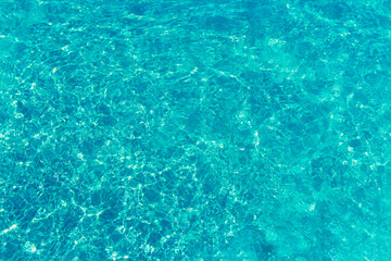 texture of blue water in the pool close-up, there is a place for an inscription