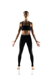 Portrait of young beautiful woman in black sportswear doing yoga practice