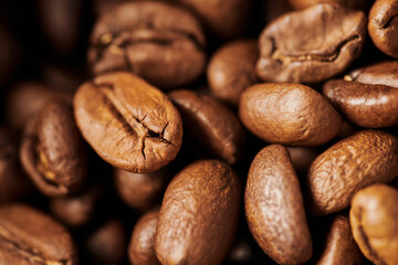 close up, brown coffee beans in wooden box, medium roast, caffeine and energy, coffee background