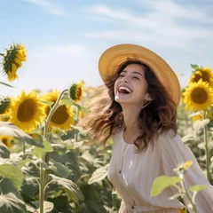 Fototapeten girl in a sunflower field © RDO