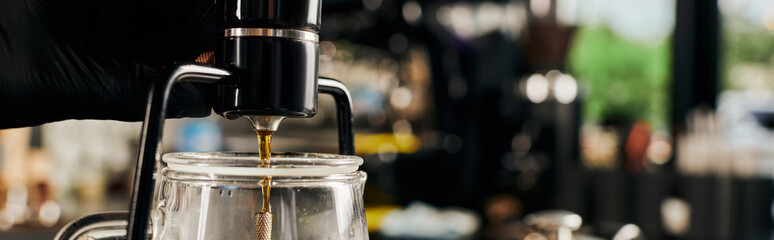 partial view of barista brewing fresh espresso and regulating siphon coffee maker, banner