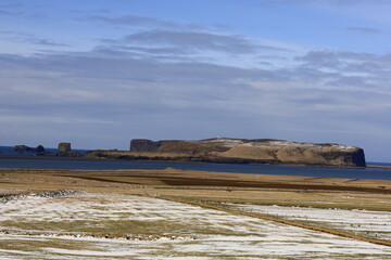 View on Dyrhólaey formerly known by seamen as Cape Portland which is a small promontory located on the south coast of Iceland, not far from the city of Vik.
