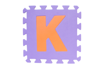 ฺJigsaw English English uppercase "K" alphabet foam plastic Isolated on cutout PNG. Jigsaw box with character. Colorful foam alphabet puzzle pieces. English used in learning education for children.