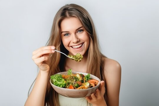 Woman eating salad, happy healthy eat vegetable 