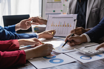 The fund manager team consults and discusses stock market analysis by meeting digital tablet business consultants to analyze and discuss the financial report situation in the conference room