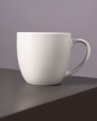 white ceramic mug on the table 