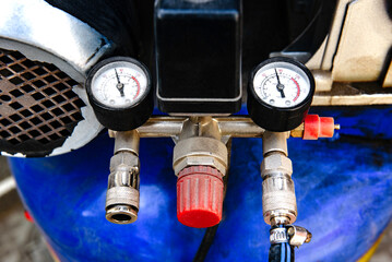 Blue piston air compressor, used outdoor.