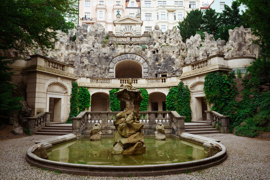 Prague, Czech Republik - June 23, 2023: Statue of Neptune, Grotta fountain in Grebovka, Havlicek Gardens, Havlickovy zahrady, Praha, Czechia - Sculpture of mythical god. High quality photo