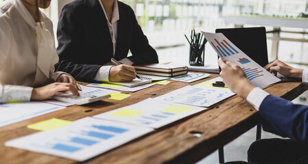 Business meeting, colleagues brainstorm together, discuss business project planning and analyze the company's investment growth. Collaboration of people in an organization.