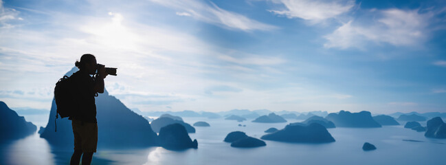 Men travel photography on the Mountain. Tourist on summer holiday vacation. Landscape Beautiful Mountain on sea at Samet Nangshe Viewpoint. Phang Nga Bay, Travel Thailand, Travel adventure nature.