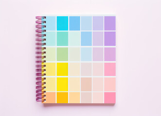   a notebook on a pink background
