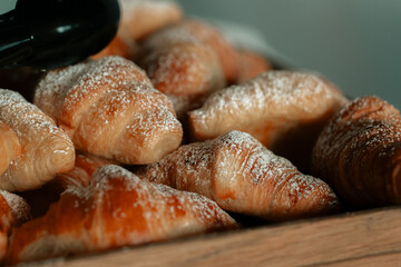 Croissant bakery tray of food, breakfast French pastry