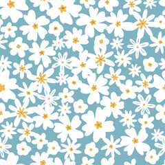 Delicate white flowers on a blue background. Simple and different flowers..Seamless pattern