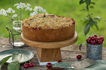 sour cherry crumble cake on  wooden table