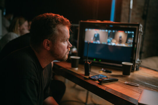 Director at work on the set. The director works with a group or with a playback while filming a movie