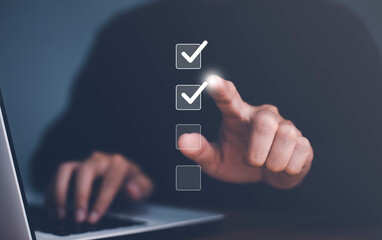 Businessman use finger to tick correct sign mark in checkbox for quality document control checklist...