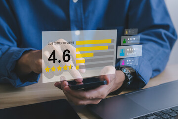 Businessman man gives rating to service experience on online application.Customer review and...