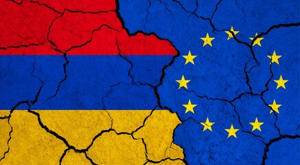 Flags of Armenia and European Union on cracked surface - politics, relationship concept