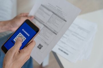 Pay online, QR codes to pay credit card bill after receiving document invoice online. payment, receive, paying electricity, digital payments, technology, scanning, financial transactions