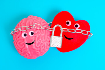 Cute Heart and Brain Characters Linked by Chain and Padlock on Blue