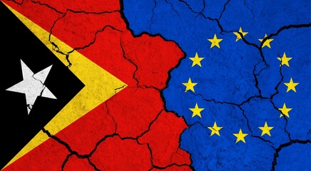 Flags of East Timor and European Union on cracked surface - politics, relationship concept