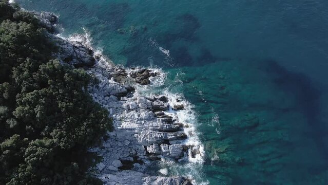 Drone 4k sea waves and rocks Mylopotamos Greece summer clear waters