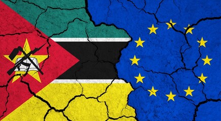 Flags of Mozambique and European Union on cracked surface - politics, relationship concept