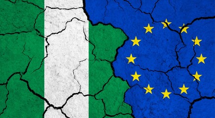 Flags of Nigeria and European Union on cracked surface - politics, relationship concept