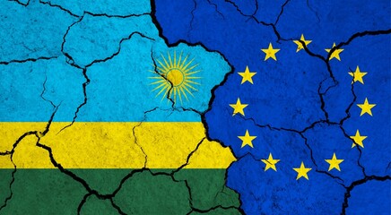 Flags of Rwanda and European Union on cracked surface - politics, relationship concept