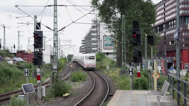 The German "ICE" highspeed train depart from the train station of Deutz operated by DB, slow motion