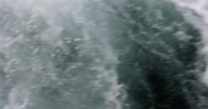 Sea water with sea foam and strong current. Waves of river and sea water meet at high and low tide